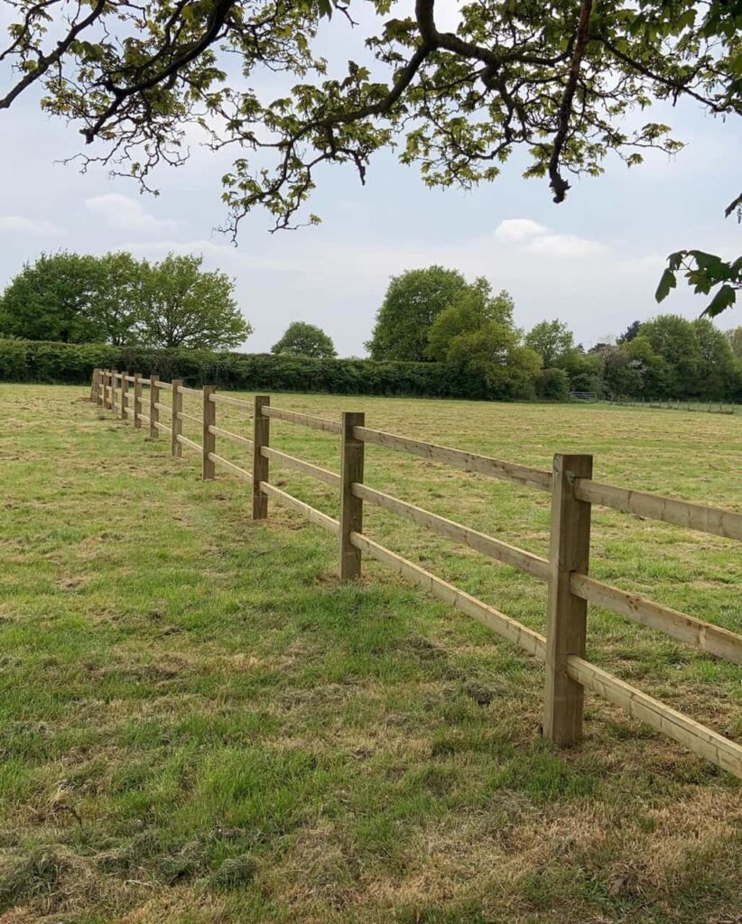 This is a photo of a post and rail fence installed in a field by Fast Fix Fencing Doddington