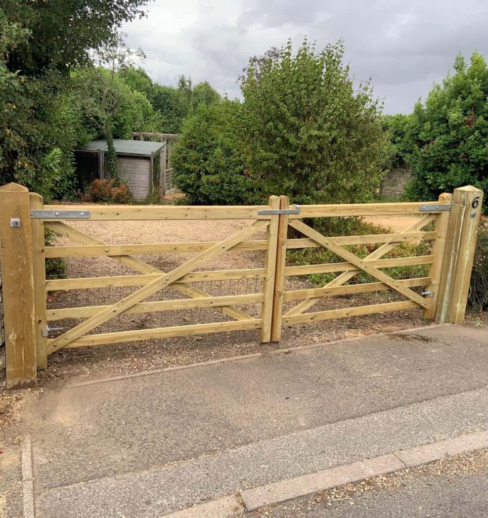 This is a photo of a wooden driveway gate installed by Fast Fix Fencing Doddington
